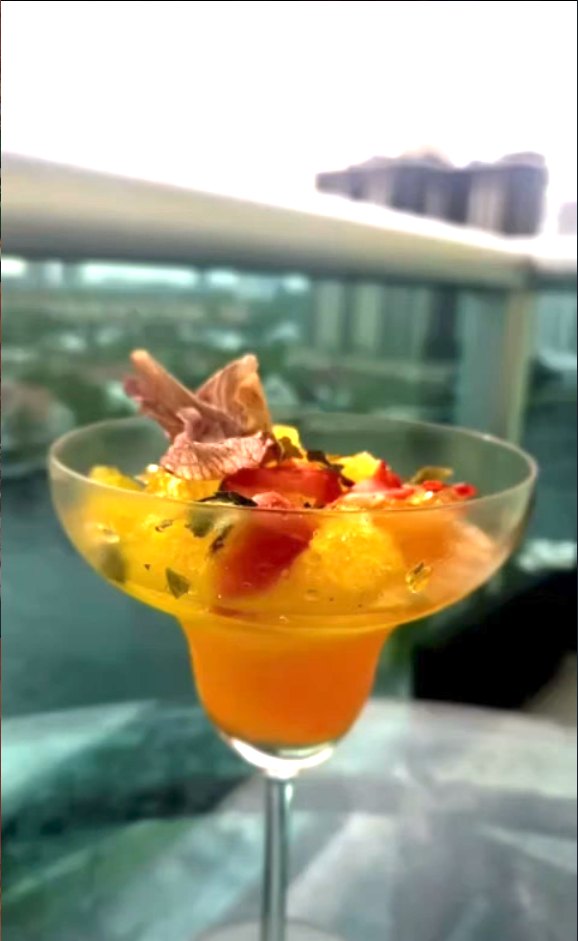 Fruit cocktail with a skyline view