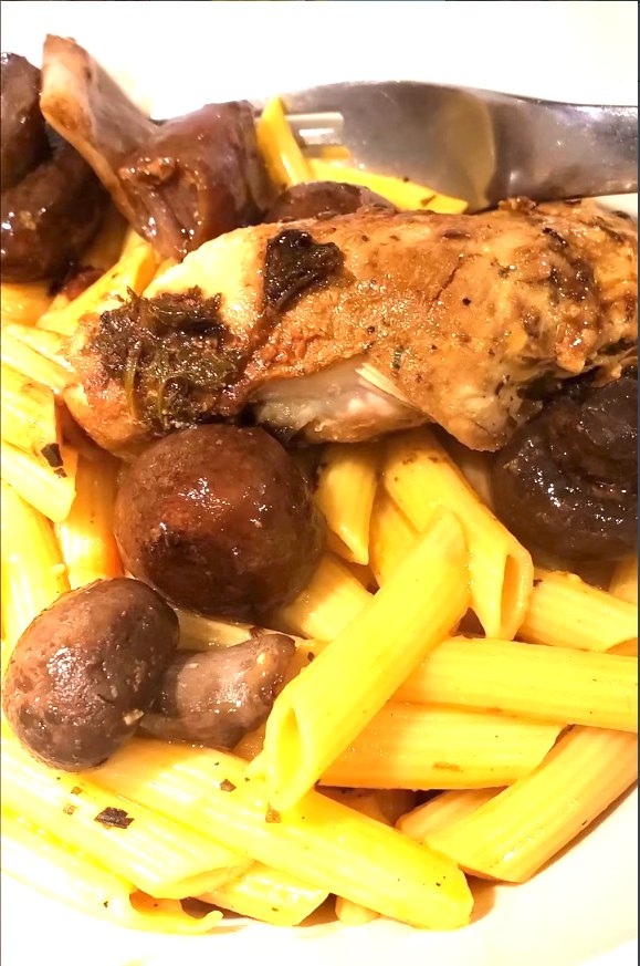 Roasted chicken with mushrooms over pasta